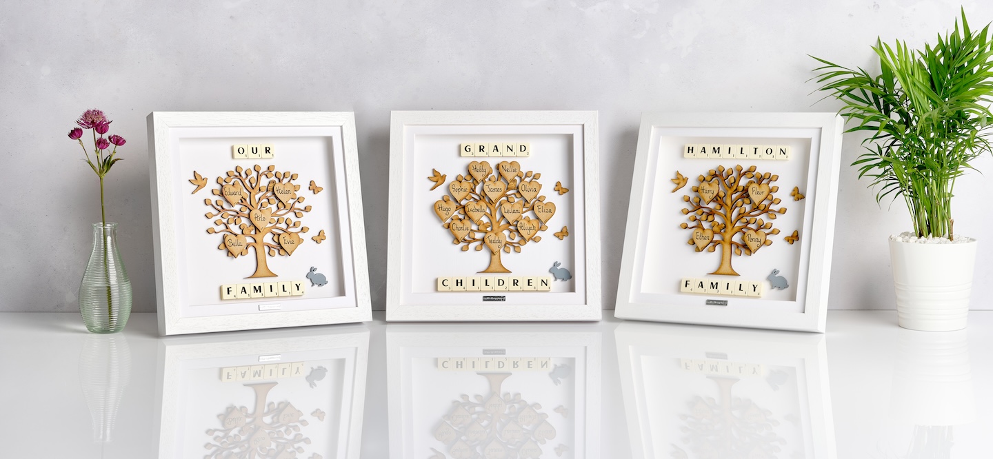 Wooden Family Tree Gift Frames with personalised name hearts and scrabble-tile accents in white frames, handcrafted by A Gift of Happiness.