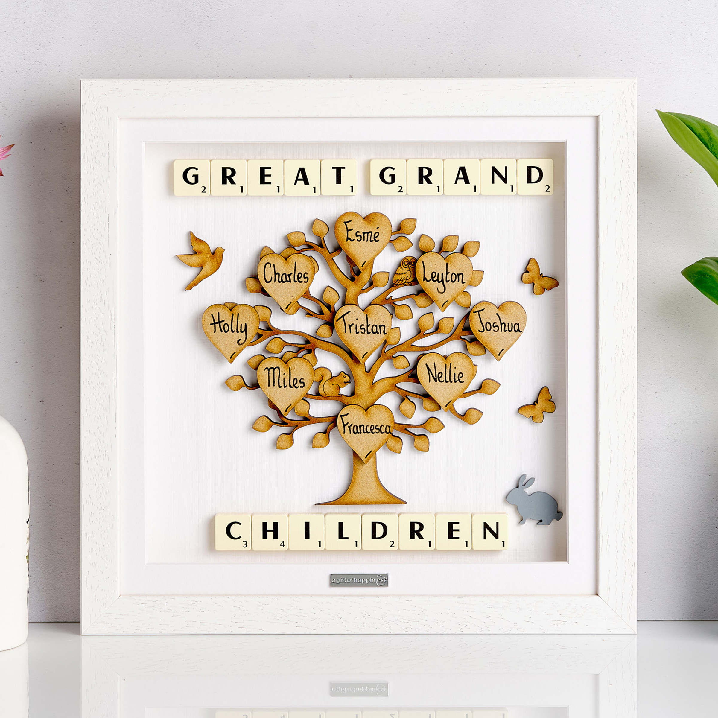 Personalised wooden family tree frame with handwritten heart names and Scrabble tiles spelling 