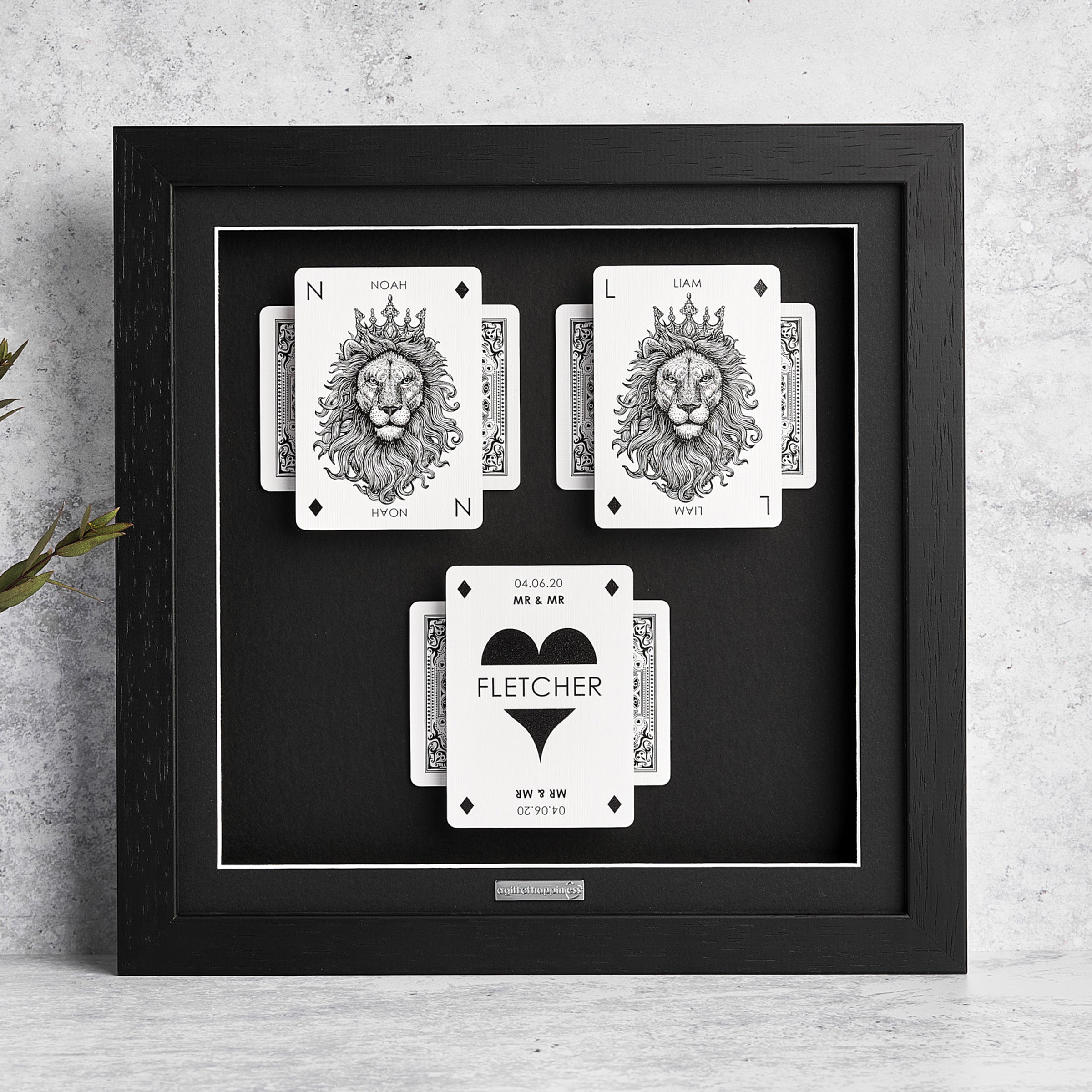 Personalised same-sex couples playing card frame with lion design and heart surname card in black frame