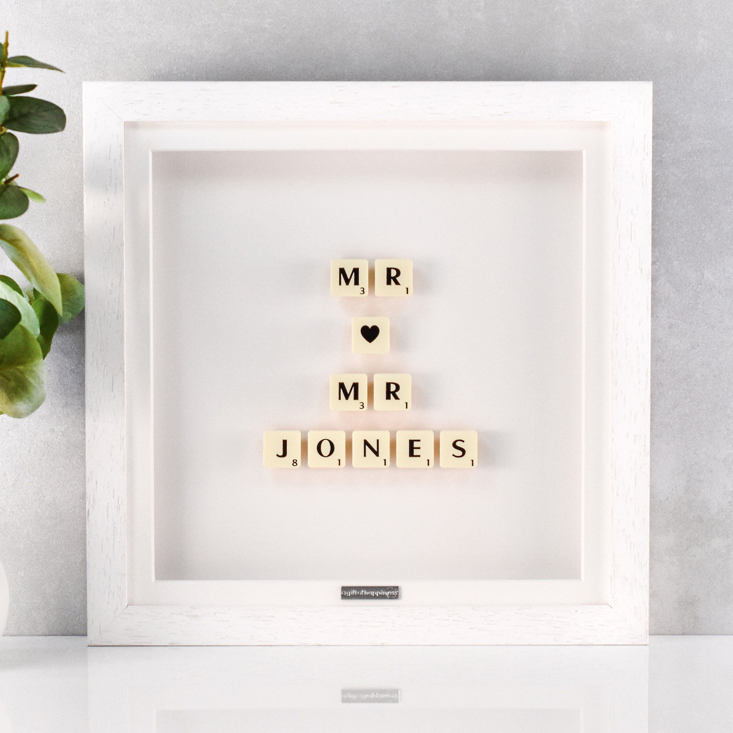 Personalised wedding gift frame with Scrabble tiles spelling “Mr ♥ Mr” and married surname in white box frame